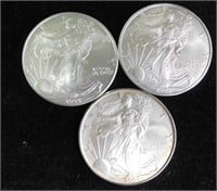 (3) near uncirculated silver Eagle one-dollar
