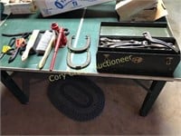 Older tool box with antique tools, horse shoes,