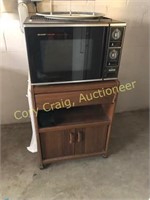 Sharp Carousel Microwave with stand and contents