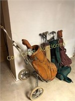 Assortment of golf clubs, bags and caddy