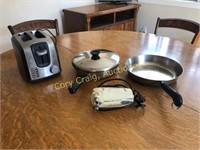 Toaster, pans and a vintage mixer with no beaters.