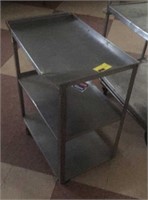 Stainless steel rolling cart with dent