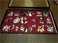 Collection of 31 costume jewelry earrings with a