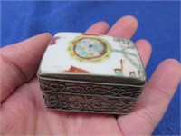 small handmade pill box (painted porc lid)