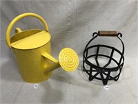 water can, sad iron, candle holder, basket