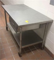 Rolling stainless steel table with drawer