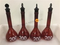 GROUP OF RED GLASS FLASKS
