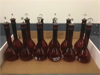 GROUP OF RED GLASS FLASKS