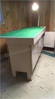 Large handmade wooden workbench with cabinets