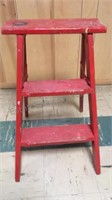 Red wooden step ladder