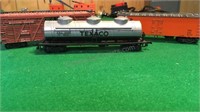 Texaco tanker, Missouri Pacific car, and S
