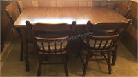 Wooden table with 4 chairs, table size 57” x 34”