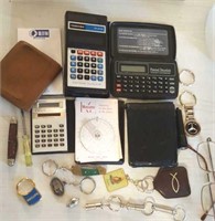 Calculators, key rings glasses, billfolds