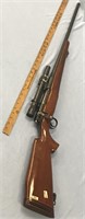 Custom made Mauser action rifle, has a Redfield Te