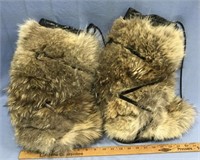 Pair of wolf skin muk luks with rubber soles, 9.5"