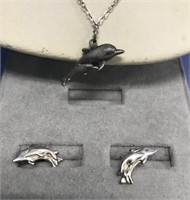 Sterling silver pendant with dolphin and a pair of