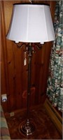 Brass three arm floor lamp with shade