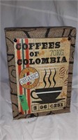 METAL COLUMBIA COFFE SIGN MOUNTED ON COFFEE SACK