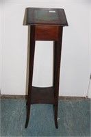 Mahogany plant stand with tile insert.