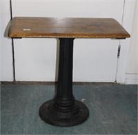 Oak top table with cast iron base.