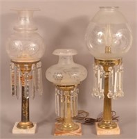 Three Antique Pedestal Fluid lamps.