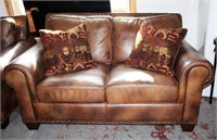 Love Seat in Leather Like Upholstery