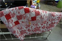 Red and white twin size quilted bedspread