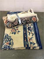 Pair of white and blue machine made wool rugs