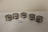5  plated napkin rings with Douglas coat of arms.