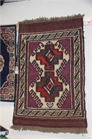 Handmade tribal middle eastern rug.