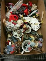 Box of dolls and black figurines Etc