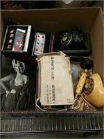 Box of old phones, slot machine, and Marilyn