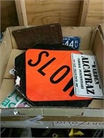 Box of signs and license plates