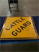 Cattle guard yellow metal sign
