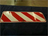 Red and white metal sign