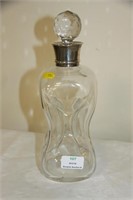 Quality pinch decanter with silver collar.