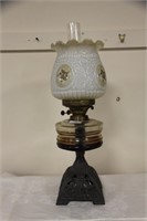 Oil lamp with cast base c.1900.