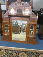 ANTIQUE CARVED WALNUT AND BEVELED GLASS OVER