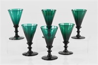 Six Georgian emerald green baluster wine glasses