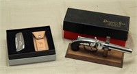 table model Derringer gun lighter and a Zippo