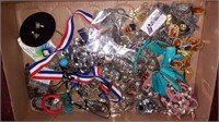 Flat of jewelry and pins