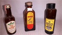 Vintage glass liqueur and extract bottles