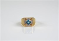 Gold and blue topaz ring