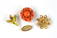Three gold pins and a coral brooch pin