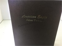 BOOK OF AMERICAN EAGLE SILVER DOLLARS,