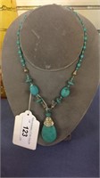 BLUE BEADED NECKLACE WITH BLUE OVAL PENDANT