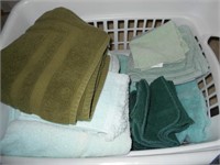 1 White Laundry  Basket of Green Towels