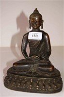 Patinated brass seated Buddha,