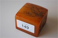 Small amber coloured soap stone chop seal,