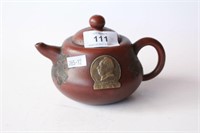 Yixing covered teapot, decorated with a medallion